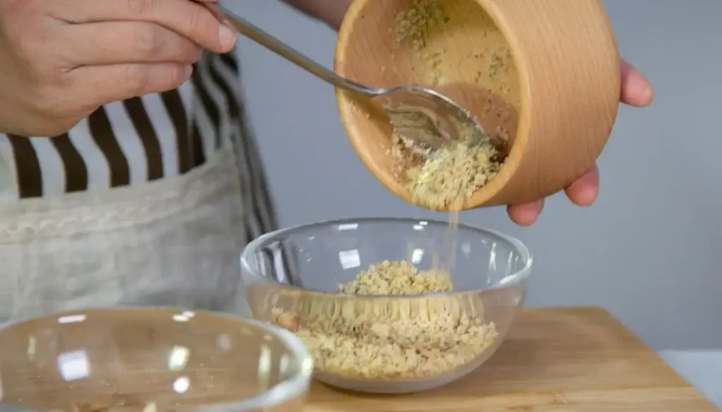 Grind walnuts for baklava