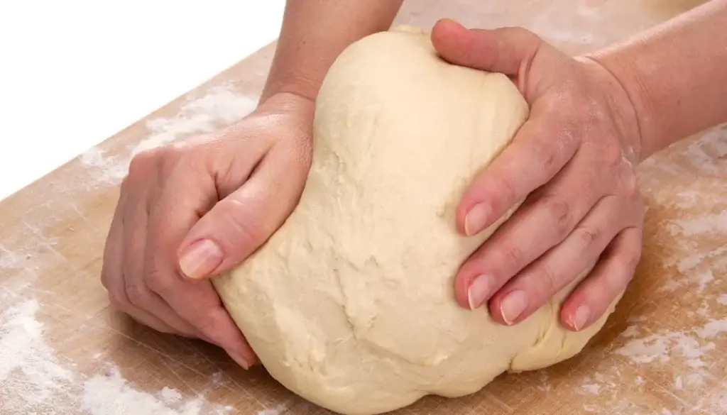 Knead the dough for momos