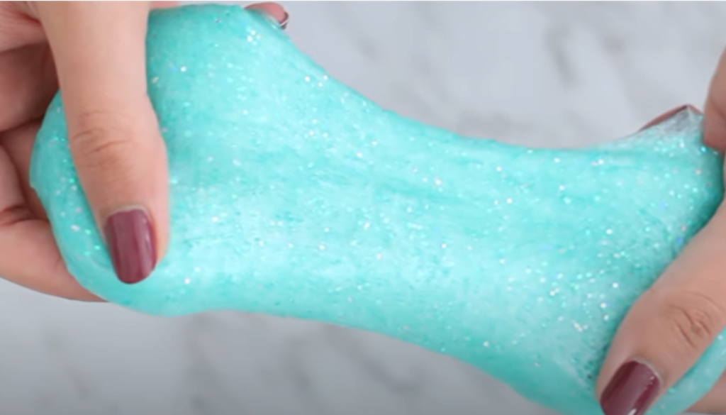 Knead the glitter slime