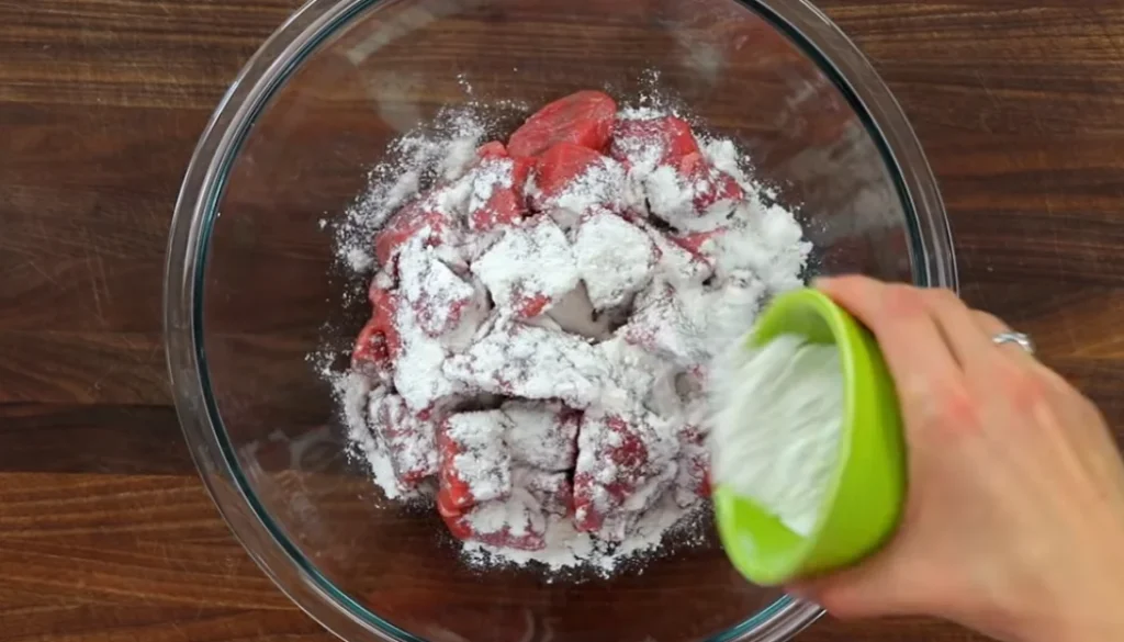 Seasoning the beef chunks