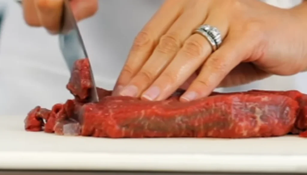 Slice beef into strips